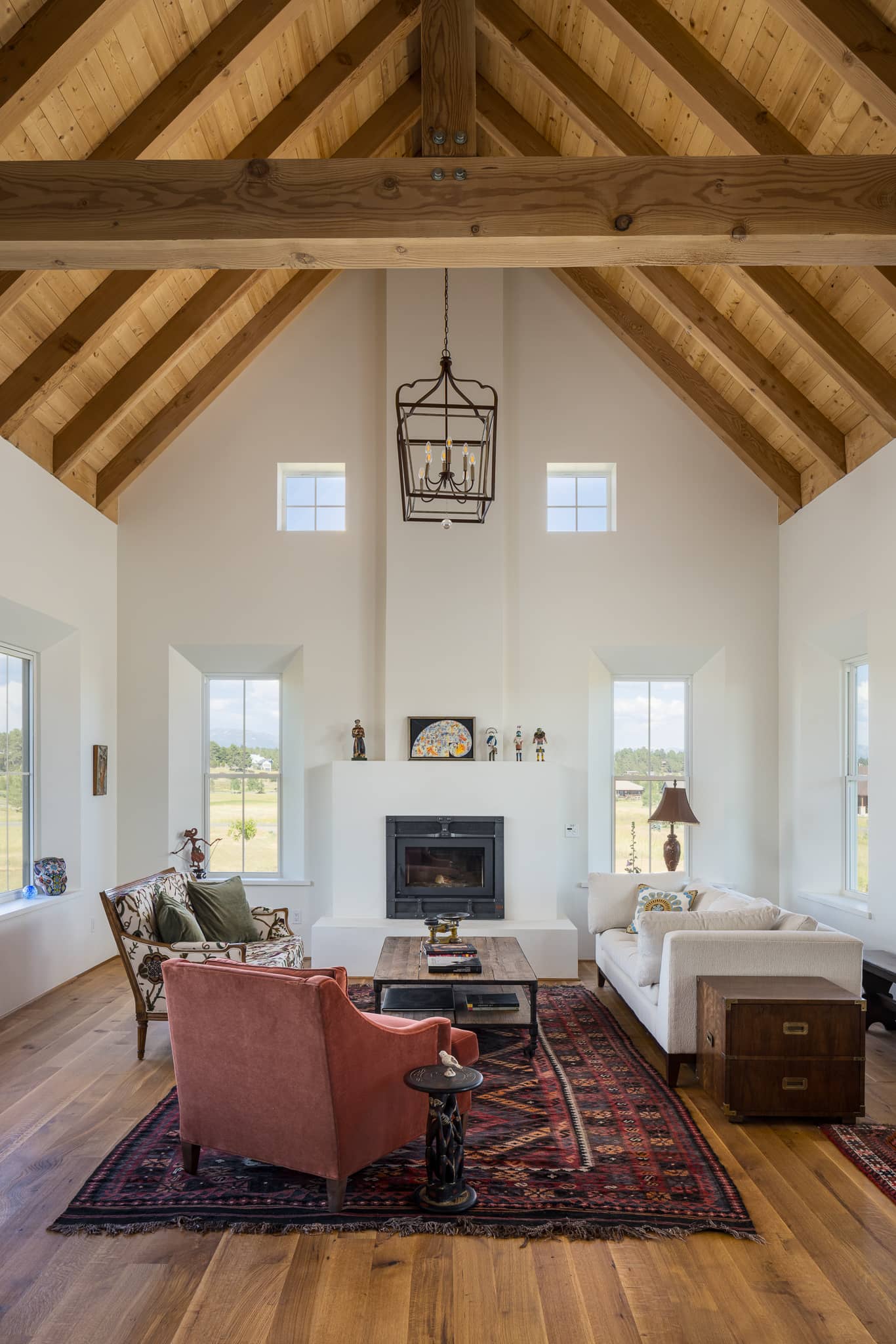 Traditional Living Room with Vaulted Wood Ceilings, a Crossbeam and Curated Furnishings